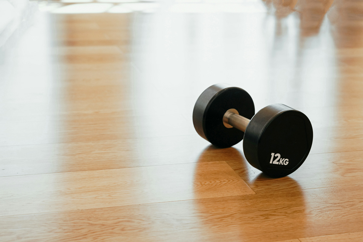 A dumbbell on a wood floor
